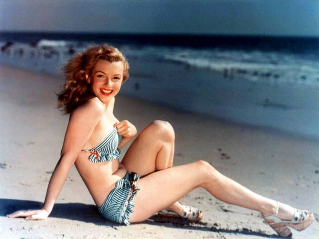 Norma Jeane Posing for a postcard by the sea (Circa 1946)